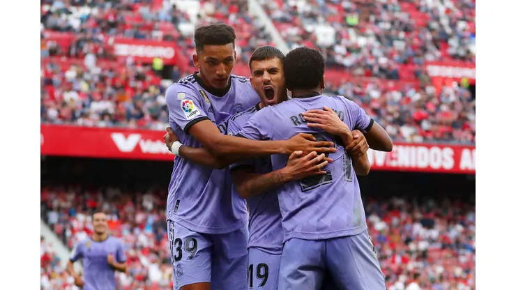 SEVILLE, SPAIN - MAY 27: Rodrygo of Real Madrid celebrates with teammates Alvaro Rodriguez and Dani Ceballos after scoring the team's second goal during the LaLiga Santander match between Sevilla FC and Real Madrid CF at Estadio Ramon Sanchez Pizjuan on May 27, 2023 in Seville, Spain. (Photo by Fran Santiago/Getty Images)