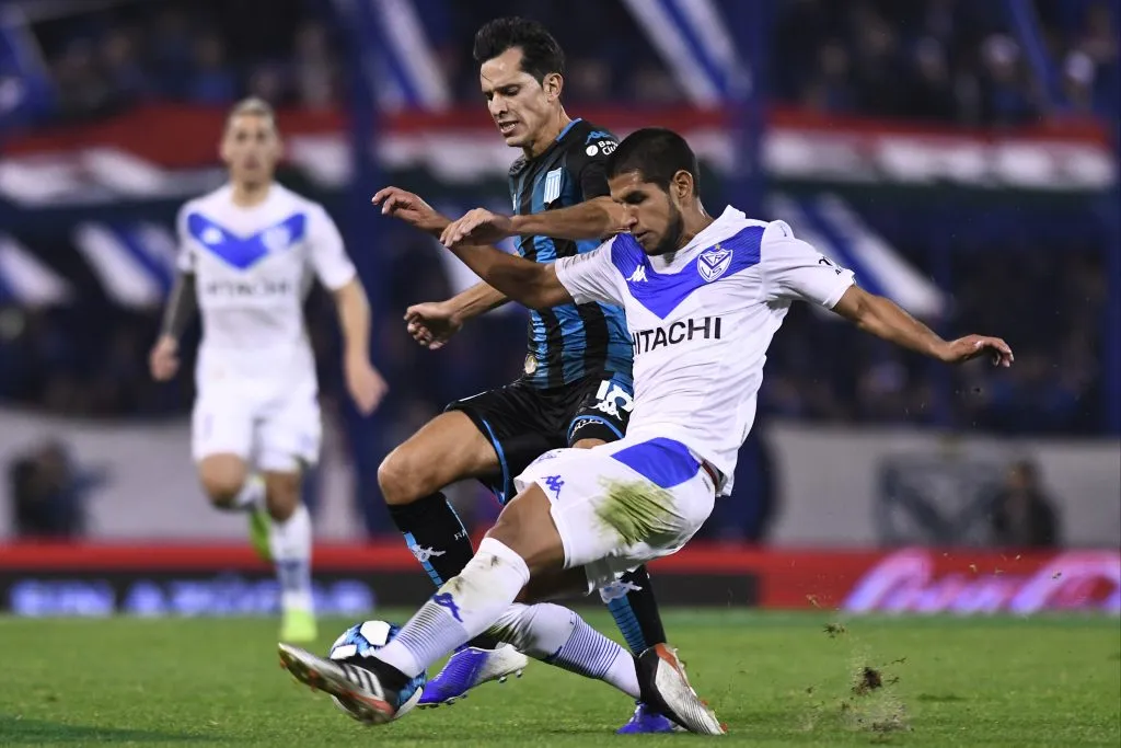 BUENOS AIRES, ARGENTINA – AUGUST 03: Luis Abram of Velez fights for the ball with Augusto Solari of Racing Club during a match between Velez and Racing Club as part of Superliga Argentina 2019/20 at Jose Amalfitani Stadium Jose Amalfitani Stadium on August 3, 2019 in Buenos Aires, Argentina. (Photo by Rodrigo Valle/Getty Images)
