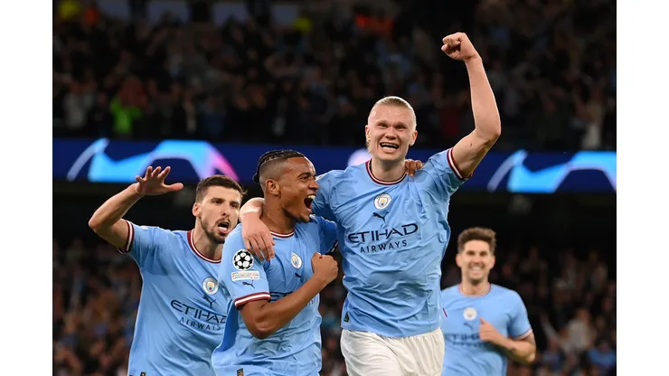 MANCHESTER, ENGLAND - MAY 17: Manuel Akanji celebrates with Erling Haaland of Manchester City after an own goal by Eder Militao of Real Madrid (not pictured) Manchester City's third goal during the UEFA Champions League semi-final second leg match between Manchester City FC and Real Madrid at Etihad Stadium on May 17, 2023 in Manchester, England. (Photo by Michael Regan/Getty Images)