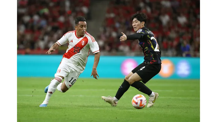 BUSAN, SOUTH KOREA - JUNE 16: Christian Cueva of Peru competes for the ball with Hong Hyun-Seok of South Korea during the international friendly match between South Korea and Peru at Busan Asiad Stadium on June 16, 2023 in Busan, South Korea. (Photo by Chung Sung-Jun/Getty Images)