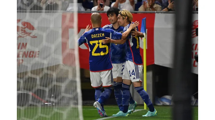 SUITA, JAPAN - JUNE 20: Junya Ito (R) of Japan celebrates with teammates Kaoru Mitoma (C) and Daizen Maeda (L) after scoring the team's third goal during the international friendly match between Japan and Peru at Panasonic Stadium Suita on June 20, 2023 in Suita, Osaka, Japan. (Photo by Kenta Harada/Getty Images)