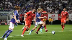 SUITA, JAPAN - JUNE 20: Ritsu Doan of Japan competes for the ball against Wilder Cartagena and Carlos Zambrano of Peru during the international friendly match between Japan and Peru at Panasonic Stadium Suita on June 20, 2023 in Suita, Osaka, Japan. (Photo by Koji Watanabe/Getty Images)