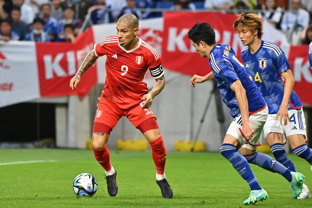 SUITA, JAPAN – JUNE 20: Paolo Guerrero of Peru controls the ball against Shogo Taniguchi of Japan during the international friendly match between Japan and Peru at Panasonic Stadium Suita on June 20, 2023 in Suita, Osaka, Japan. (Photo by Kenta Harada/Getty Images)