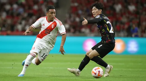 BUSAN, SOUTH KOREA - JUNE 16: Christian Cueva of Peru competes for the ball with Hong Hyun-Seok of South Korea during the international friendly match between South Korea and Peru at Busan Asiad Stadium on June 16, 2023 in Busan, South Korea. (Photo by Chung Sung-Jun/Getty Images)