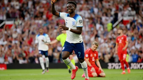MANCHESTER, ENGLAND - JUNE 19: Bukayo Saka of England celebrates after scoring the team's fifth goal and his third during the UEFA EURO 2024 qualifying round group C match between England and North Macedonia at Old Trafford on June 19, 2023 in Manchester, England. (Photo by Justin Setterfield/Getty Images)