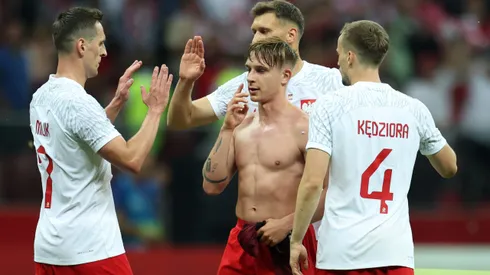 WARSAW, POLAND - JUNE 16: Michal Skoras and team mates of Poland celebrate following their sides victory after the international friendly match between Poland and Germany at Stadion Narodowy on June 16, 2023 in Warsaw, Poland. (Photo by Maja Hitij/Getty Images)
