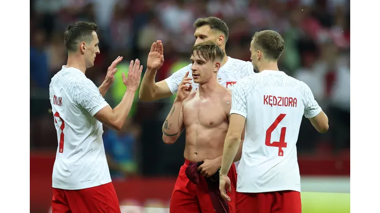 WARSAW, POLAND - JUNE 16: Michal Skoras and team mates of Poland celebrate following their sides victory after the international friendly match between Poland and Germany at Stadion Narodowy on June 16, 2023 in Warsaw, Poland. (Photo by Maja Hitij/Getty Images)