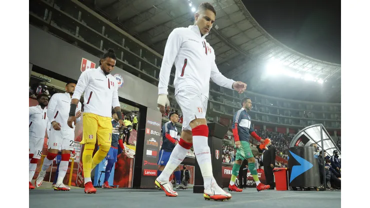 LIMA, PERU - OCTOBER 07: Paolo Guerrero of Peru and teammates enter the pitch prior to a match between Peru and Chile as part of South American Qualifiers for Qatar 2022 at Estadio Nacional on October 07, 2021 in Lima, Peru. (Photo by Daniel Apuy/Getty Images)