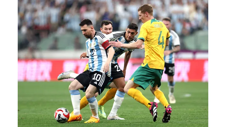 BEIJING, CHINA - JUNE 15: Lionel Messi of Argentina controls the ball against Kye Rowles of Australia during the international friendly match between Argentina and Australia at Workers Stadium on June 15, 2023 in Beijing, China. (Photo by Lintao Zhang/Getty Images)