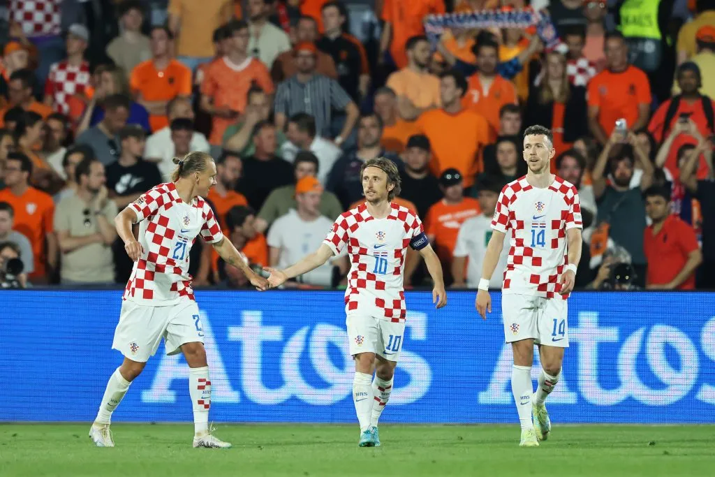 ROTTERDAM, NETHERLANDS – JUNE 14: Luka Modric of Croatia celebrates with teammate Domagoj Vida after scoring the team’s fourth goal during the UEFA Nations League 2022/23 semifinal match between Netherlands and Croatia at De Kuip on June 14, 2023 in Rotterdam, Netherlands. (Photo by Christof Koepsel/Getty Images)