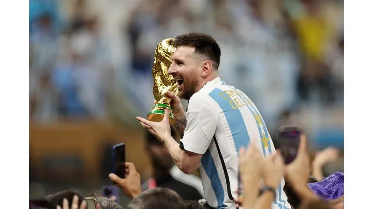 LUSAIL CITY, QATAR - DECEMBER 18: Lionel Messi of Argentina celebrates with the FIFA World Cup Qatar 2022 Winner's Trophy after the team's victory during the FIFA World Cup Qatar 2022 Final match between Argentina and France at Lusail Stadium on December 18, 2022 in Lusail City, Qatar. (Photo by Lars Baron/Getty Images)