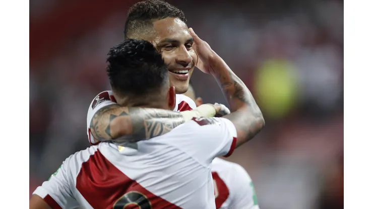 LIMA, PERU - OCTOBER 07: Christian Cueva of Peru celebrates with teammate Paolo Guerrero after scoring the first goal of his team during a match between Peru and Chile as part of South American Qualifiers for Qatar 2022 at Estadio Nacional on October 07, 2021 in Lima, Peru. (Photo by Paolo Aguilar-Pool/Getty Images)