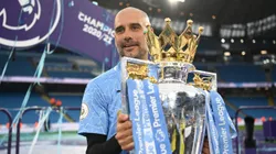 MANCHESTER, ENGLAND - MAY 23: Pep Guardiola, Manager of Manchester City celebrates with the Premier League Trophy as Manchester City are presented with the Trophy as they win the league following the Premier League match between Manchester City and Everton at Etihad Stadium on May 23, 2021 in Manchester, England. A limited number of fans will be allowed into Premier League stadiums as Coronavirus restrictions begin to ease in the UK. (Photo by Michael Regan/Getty Images)