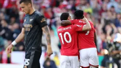 NOTTINGHAM, ENGLAND - MAY 20: Taiwo Awoniyi celebrates with Morgan Gibbs-White of Nottingham Forest after scoring the team's first goal during the Premier League match between Nottingham Forest and Arsenal FC at City Ground on May 20, 2023 in Nottingham, England. (Photo by Catherine Ivill/Getty Images)