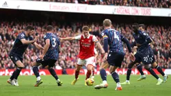 LONDON, ENGLAND - OCTOBER 30: Martin Odegaard is surrounded by Nottingham Forest players before scoring his sides fifth goal during the Premier League match between Arsenal FC and Nottingham Forest at Emirates Stadium on October 30, 2022 in London, England. (Photo by Alex Pantling/Getty Images)