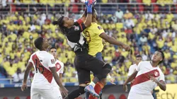 BARRANQUILLA, COLOMBIA - JANUARY 28: Pedro Gallese goalkeeper of Peru jumps to save the ball against Miguel Borja of Colombia during a match between Colombia and Peru as part of FIFA World Cup Qatar 2022 Qualifiers at Roberto Melendez Metropolitan Stadium on January 28, 2022 in Barranquilla, Colombia. (Photo by Gabriel Aponte/Getty Images)