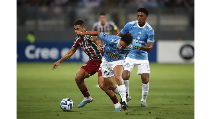 LIMA, PERU - APRIL 05: Jesus Pretell of Sporting Cristal fights for the ball with André of Fluminense during a Copa CONMEBOL Libertadores 2023 group D match between Sporting Cristal and Fluminense at Estadio Nacional de Lima on April 05, 2023 in Lima, Peru. (Photo by Daniel Apuy/Getty Images)