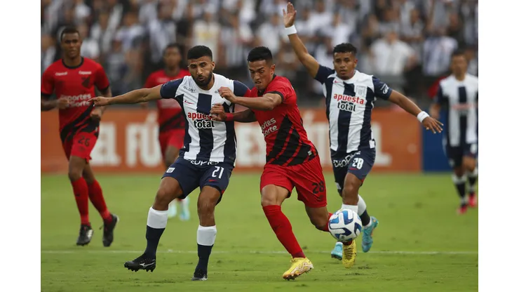 LIMA, PERU - APRIL 04: Josepmir Ballon of Alianza Lima fights for the ball with Tomas Cuello of Athletico Paranaense during a Copa CONMEBOL Libertadores group G match between Alianza Lima and Athletico Paranaense at Estadio Alejandro Villanueva on April 4, 2023 in Lima, Peru. (Photo by Daniel Apuy/Getty Images)