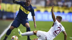 BUENOS AIRES, ARGENTINA - FEBRUARY 17: Julio Buffarini of Boca Juniors fights for the ball with Nicolas Pasquini of Lanus during a match between Boca Juniors and Lanus as part of Superliga 2018/19 at Estadio Alberto J. Armando on February 17, 2019 in Buenos Aires, Argentina. (Photo by Marcelo Endelli/Getty Images)