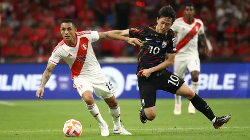 BUSAN, SOUTH KOREA – JUNE 16: Lee Jae-Sung of South Korea competes for the ball with Yoshimar Yotun of Peru during the international friendly match between South Korea and Peru at Busan Asiad Stadium on June 16, 2023 in Busan, South Korea. (Photo by Chung Sung-Jun/Getty Images)