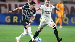 LIMA, PERU - JULY 18: Giuliano of Corinthians battles for the ball with Emanuel Herrera of Universitario during the second leg of the round of 32 playoff match between Universitario and Corinthians at Estadio Monumental de la U on July 18, 2023 in Lima, Peru. (Photo by Raul Sifuentes/Getty Images)