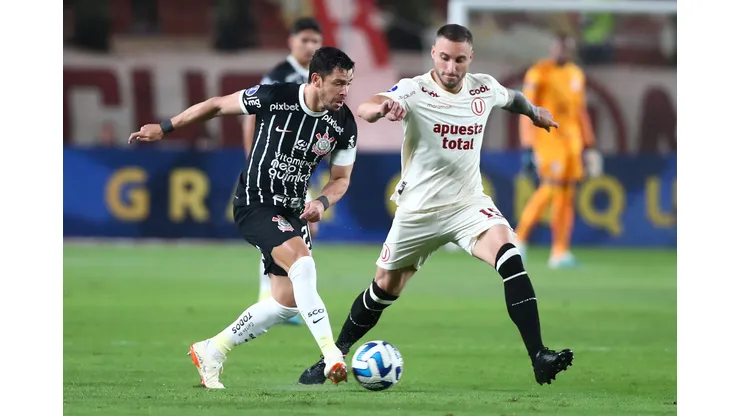 LIMA, PERU - JULY 18: Giuliano of Corinthians battles for the ball with Emanuel Herrera of Universitario during the second leg of the round of 32 playoff match between Universitario and Corinthians at Estadio Monumental de la U on July 18, 2023 in Lima, Peru. (Photo by Raul Sifuentes/Getty Images)