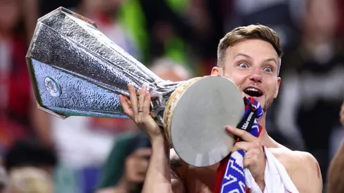 BUDAPEST, HUNGARY - MAY 31: Ivan Rakitic of Sevilla FC holds the winners trophy after the UEFA Europa League 2022/23 final match between Sevilla FC and AS Roma at Puskas Arena on May 31, 2023 in Budapest, Hungary. (Photo by Clive Rose/Getty Images)