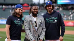 SEATTLE, WASHINGTON - JULY 10: Vladimir Guerrero Jr. #27 of the Toronto Blue Jays poses for photos with teammates Bo Bichette and Jordan Romano after winning the T-Mobile Home Run Derby at T-Mobile Park on July 10, 2023 in Seattle, Washington. (Photo by Steph Chambers/Getty Images)