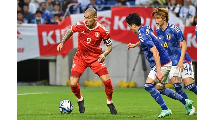 SUITA, JAPAN - JUNE 20: Paolo Guerrero of Peru controls the ball against Shogo Taniguchi of Japan during the international friendly match between Japan and Peru at Panasonic Stadium Suita on June 20, 2023 in Suita, Osaka, Japan. (Photo by Kenta Harada/Getty Images)