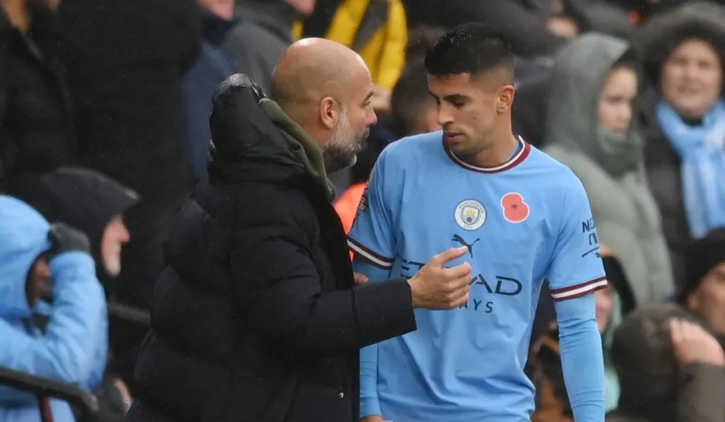 Joao Cancelo y Pep Guardiola: Getty Images