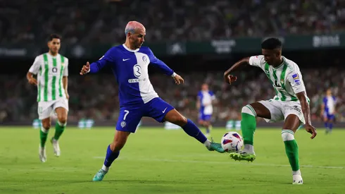 SEVILLE, SPAIN - AUGUST 20: Antoine Griezmann of Atletico Madrid and Abner of Real Betis battle for the ball during the LaLiga EA Sports match between Real Betis and Atletico Madrid at Estadio Benito Villamarin on August 20, 2023 in Seville, Spain. (Photo by Fran Santiago/Getty Images)