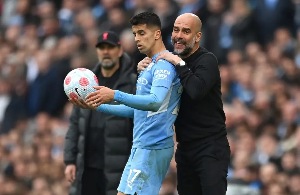 Joao Cancelo y Pep Guardiola: Getty Images