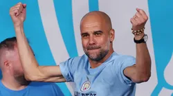 MANCHESTER, ENGLAND - JUNE 12: Pep Guardiola, Manager of Manchester City, celebrates on stage in St Peter's Square during the Manchester City trophy parade on June 12, 2023 in Manchester, England. (Photo by Alex Livesey/Getty Images)