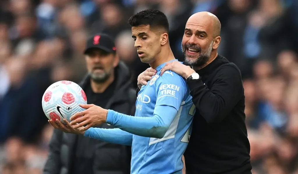 Joao Cancelo y Pep Guardiola: Getty Images