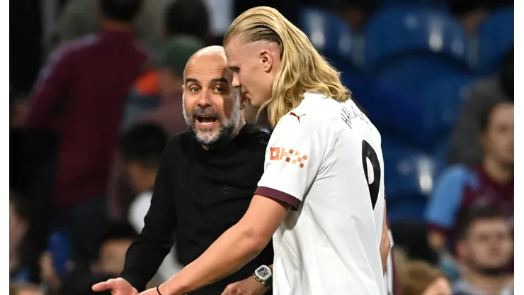 Pep Guardiola y Erling Haaland.