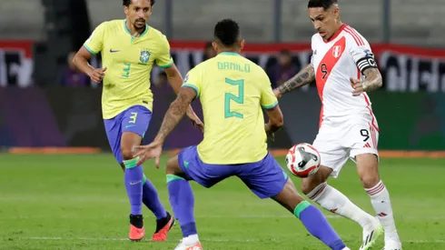 LIMA, PERU - SEPTEMBER 12: Paolo Guerrero of Peru competes for the ball with Danilo of Brazil during a FIFA World Cup 2026 Qualifier match between Peru and Brazil at Estadio Nacional de Lima on September 12, 2023 in Lima, Peru. (Photo by Mariana Bazo/Getty Images)