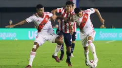 CIUDAD DEL ESTE, PARAGUAY - SEPTEMBER 07: Robert Rojas of Paraguay battles for possession with Wilder Cartagena and Marcos Lopez of Peru during a FIFA World Cup 2026 Qualifier match between Paraguay and Peru at Antonio Aranda Stadium on September 07, 2023 in Ciudad del Este, Paraguay. (Photo by Christian Alvarenga/Getty Images)