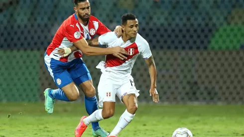 GOIANIA, BRAZIL - JULY 02: Yoshimar Yotún of Peru fights for the ball with Gabriel Avalos of Paraguay during a quarterfinal match between Peru and Paraguay as part of Copa America Brazil 2021 at Estadio Olimpico on July 02, 2021 in Goiania, Brazil. (Photo by Alexandre Schneider/Getty Images)