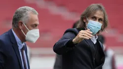 QUITO, ECUADOR - JUNE 08: Gustavo Alfaro coach of Ecuador and Ricardo Gareca Coach of Peru walk onto the field before a match between Ecuador and Peru as part of South American Qualifiers for Qatar 2022 at Rodrigo Paz Delgado Stadium on June 08, 2021 in Quito, Ecuador. (Photo by Franklin Jacome/Getty Images)