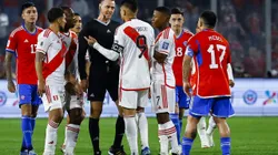 SANTIAGO, CHILE - OCTOBER 12: Referee Wilmar Roldan argues with players during the FIFA World Cup 2026 Qualifier match between Chile and Peru at Estadio Monumental David Arellano on October 12, 2023 in Santiago, Chile. (Photo by Marcelo Hernandez/Getty Images)