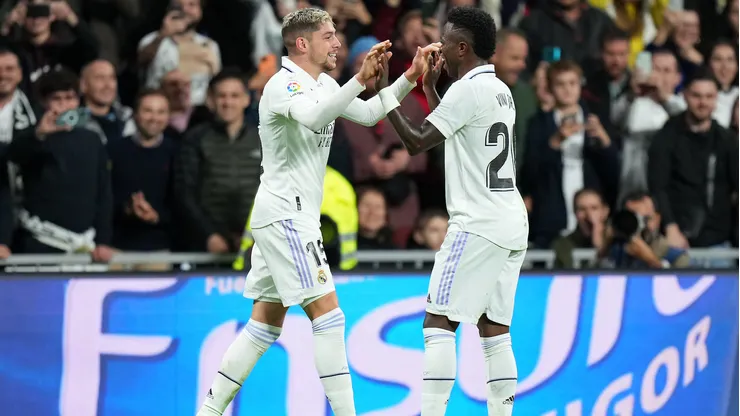 MADRID, SPAIN - OCTOBER 22: Federico Valverde celebrates with Vinicius Junior of Real Madrid after scoring their team's third goal during the LaLiga Santander match between Real Madrid CF and Sevilla FC at Estadio Santiago Bernabeu on October 22, 2022 in Madrid, Spain. (Photo by Angel Martinez/Getty Images)