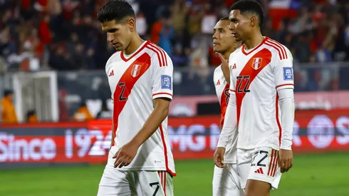 SANTIAGO, CHILE - OCTOBER 12: Luis Abram and Marcos Lopez of Peru leave the field after a defeat in the FIFA World Cup 2026 Qualifier match between Chile and Peru at Estadio Monumental David Arellano on October 12, 2023 in Santiago, Chile. (Photo by Marcelo Hernandez/Getty Images)
