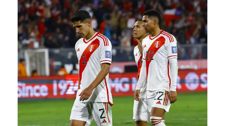 SANTIAGO, CHILE - OCTOBER 12: Luis Abram and Marcos Lopez of Peru leave the field after a defeat in the FIFA World Cup 2026 Qualifier match between Chile and Peru at Estadio Monumental David Arellano on October 12, 2023 in Santiago, Chile. (Photo by Marcelo Hernandez/Getty Images)