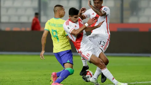 LIMA, PERU - SEPTEMBER 12: Richarlison of Brazil competes for the ball with Renato Tapia of Peru during a FIFA World Cup 2026 Qualifier match between Peru and Brazil at Estadio Nacional de Lima on September 12, 2023 in Lima, Peru. (Photo by Mariana Bazo/Getty Images)
