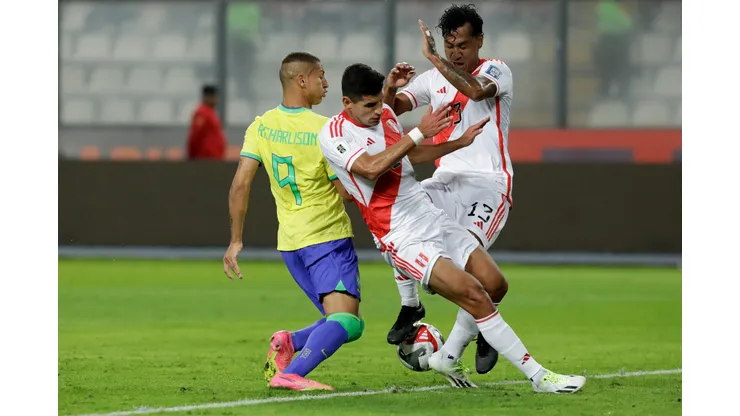 LIMA, PERU - SEPTEMBER 12: Richarlison of Brazil competes for the ball with Renato Tapia of Peru during a FIFA World Cup 2026 Qualifier match between Peru and Brazil at Estadio Nacional de Lima on September 12, 2023 in Lima, Peru. (Photo by Mariana Bazo/Getty Images)
