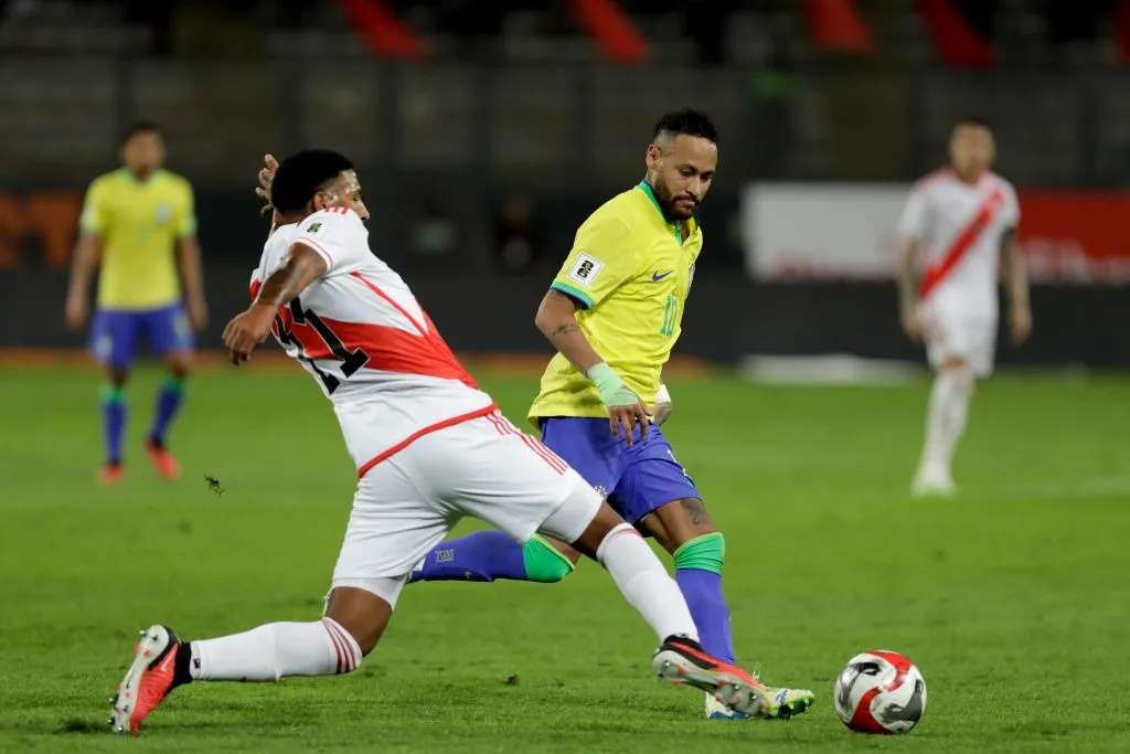 LIMA, PERU – SEPTEMBER 12: Neymar Jr. of Brazil competes for the ball with Jesus Castillo of Peru during a FIFA World Cup 2026 Qualifier match between Peru and Brazil at Estadio Nacional de Lima on September 12, 2023 in Lima, Peru. (Photo by Mariana Bazo/Getty Images)
