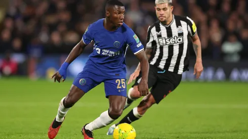LONDON, ENGLAND - DECEMBER 19: Moises Caicedo of Chelsea runs ahead of Bruno Guimaraes of Newcastle United during the Carabao Cup Quarter Final match between Chelsea and Newcastle United at Stamford Bridge on December 19, 2023 in London, England. (Photo by Julian Finney/Getty Images)