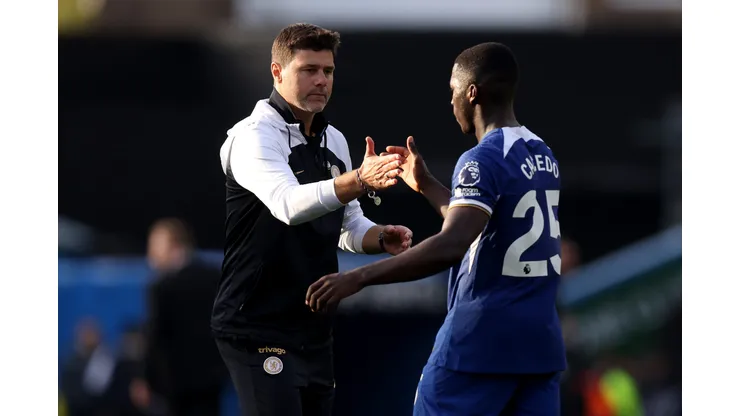 BURNLEY, ENGLAND - OCTOBER 07: Mauricio Pochettino, Manager of Chelsea, interacts with Moises Caicedo of Chelsea following the Premier League match between Burnley FC and Chelsea FC at Turf Moor on October 07, 2023 in Burnley, England. (Photo by George Wood/Getty Images)