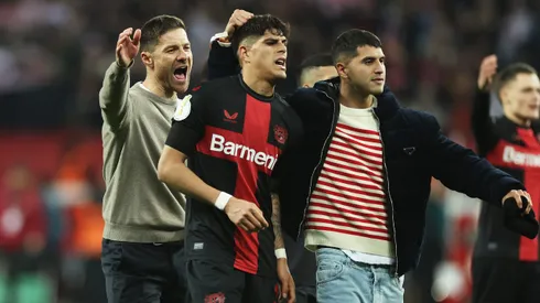 LEVERKUSEN, GERMANY – FEBRUARY 06: Piero Hincapie, Exequiel Palacios and Xabi Alonso of Bayer Leverkusen celebrates following the team's victory in the DFB cup quarterfinal match between Bayer 04 Leverkusen and VfB Stuttgart at BayArena on February 06, 2024 in Leverkusen, Germany. (Photo by Lars Baron/Getty Images)