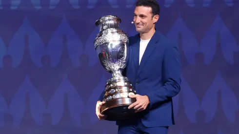 MIAMI, FLORIDA – DECEMBER 07: Lionel Scaloni, Head Coach of Argentina, presents the Copa America trophy during the official draw of CONMEBOL Copa America 2024 at James L. Knight Center on December 07, 2023 in Miami, Florida. (Photo by Eva Marie Uzcategui/Getty Images)